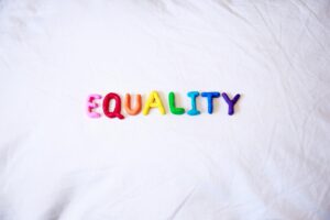 Text saying EQUALITY in rainbow colours